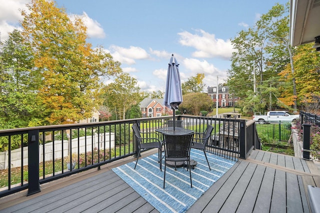 wooden terrace with outdoor dining area