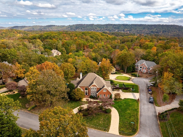 birds eye view of property with a forest view