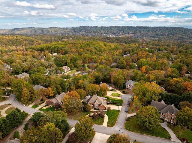 bird's eye view featuring a wooded view