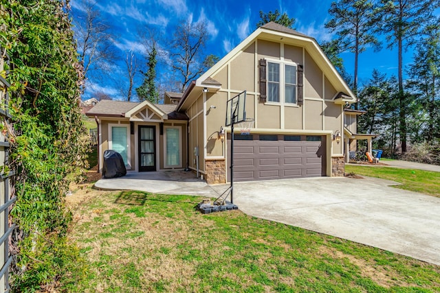 view of front of home featuring a garage, concrete driveway, stone siding, a front lawn, and stucco siding