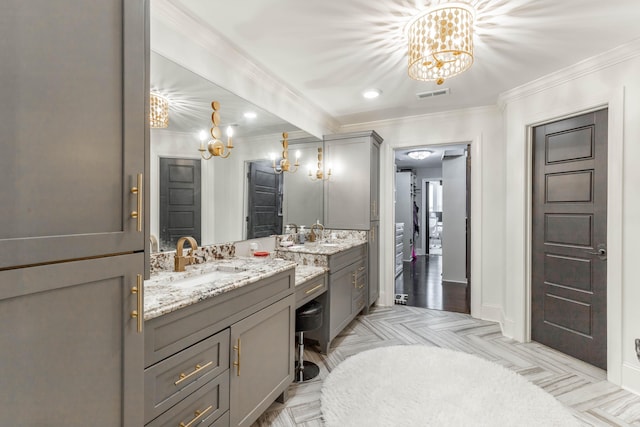 full bathroom featuring baseboards, visible vents, crown molding, vanity, and a notable chandelier