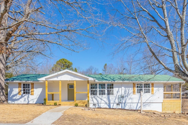 ranch-style house featuring metal roof, a porch, and crawl space