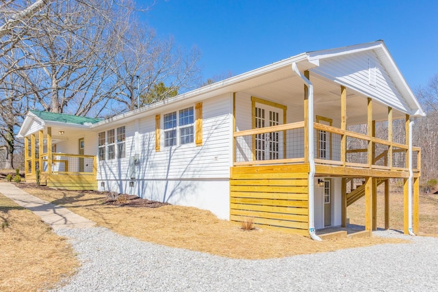 view of side of home with a porch