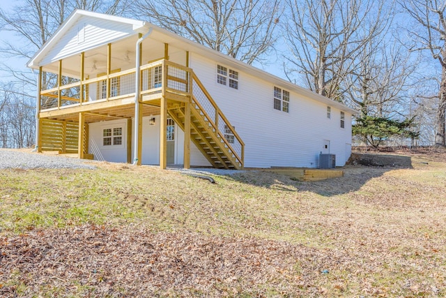 view of front of property with stairway, cooling unit, and a wooden deck