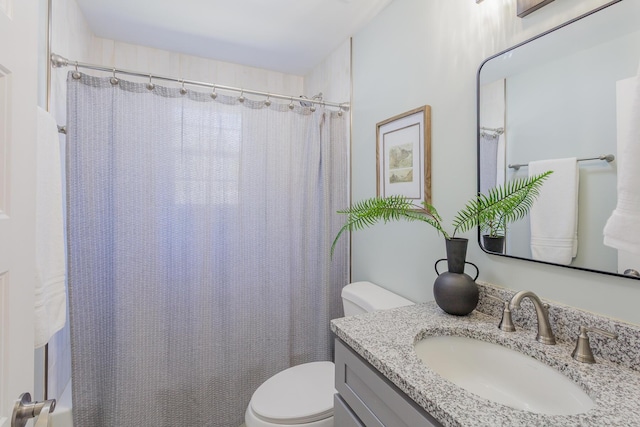 full bathroom with vanity, toilet, and a shower with curtain