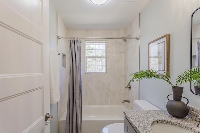 full bathroom with shower / bath combo, vanity, and toilet