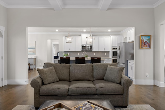 living room with ornamental molding, dark hardwood / wood-style flooring, and beam ceiling