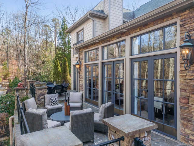 view of patio featuring french doors and outdoor lounge area