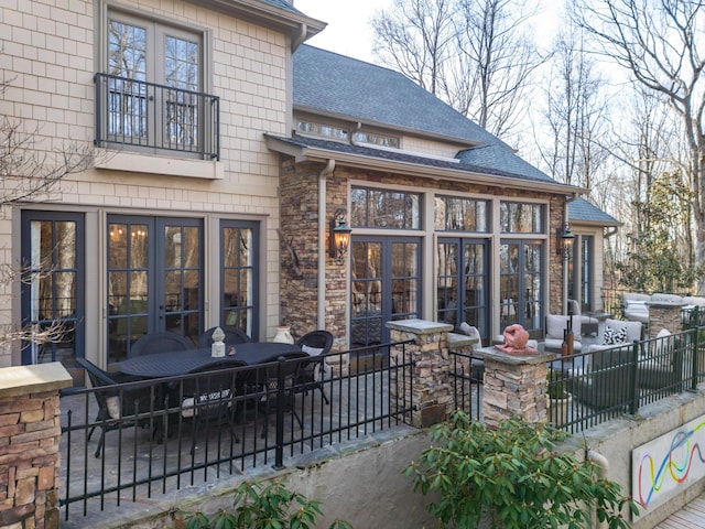 exterior space with fence and french doors