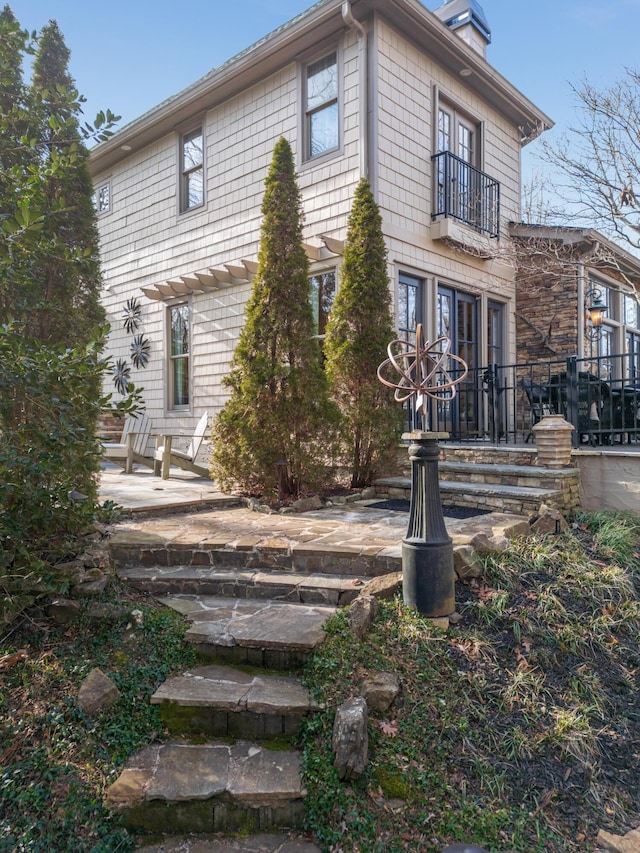 view of property exterior featuring a patio area