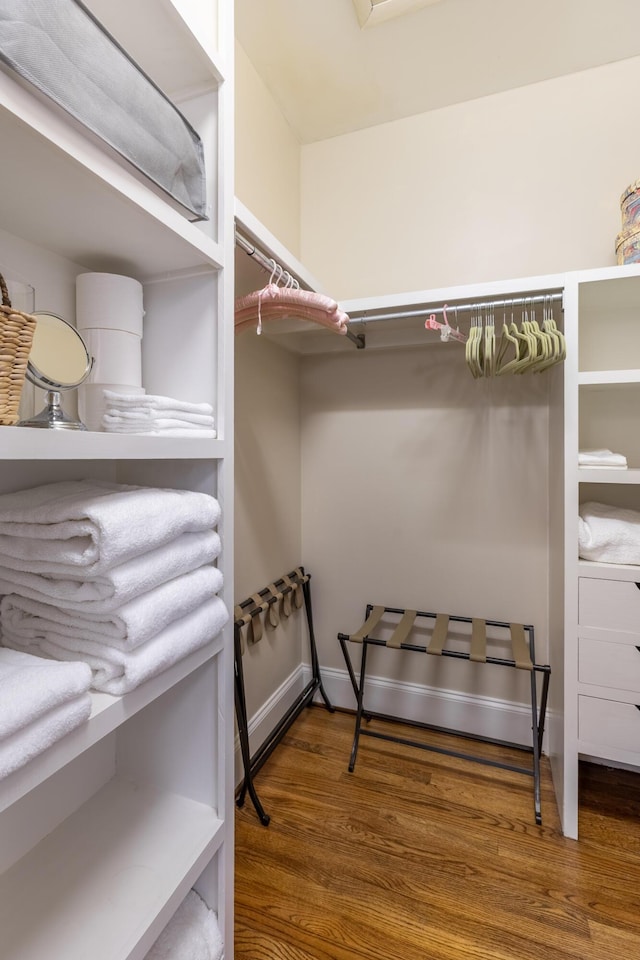 spacious closet with wood finished floors