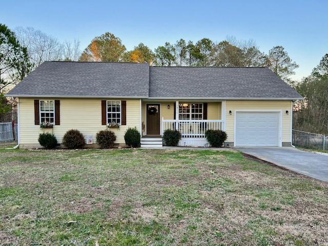 single story home featuring a garage, a shingled roof, a porch, fence, and a front lawn