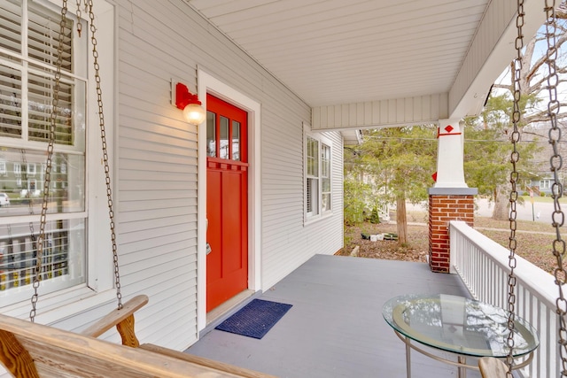 entrance to property featuring covered porch