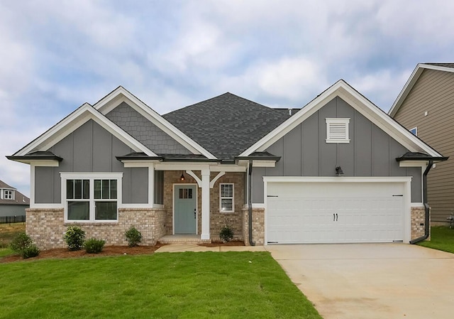 craftsman-style house featuring driveway, a garage, brick siding, board and batten siding, and a front yard