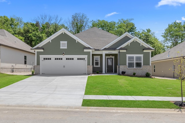 8904 Knolling Loop Unit 33, Ooltewah, TN 37363 - craftsman-style house with an attached garage, driveway, a front yard, and brick siding