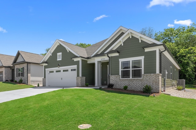 8904 Knolling Loop Unit 33, Ooltewah, TN 37363 - craftsman-style home with driveway, a garage, a front yard, and brick siding