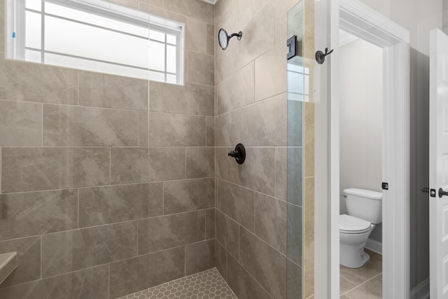 8904 Knolling Loop Unit 33, Ooltewah, TN 37363 - full bath with a tile shower, toilet, tile patterned flooring, and baseboards