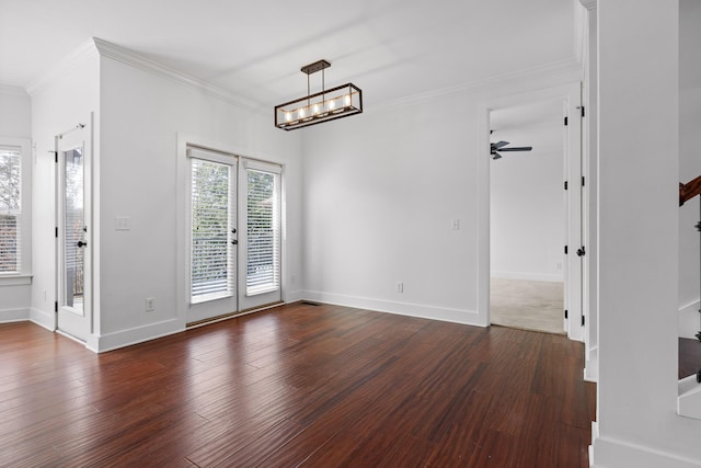 unfurnished dining area with baseboards, dark wood-style flooring, and crown molding