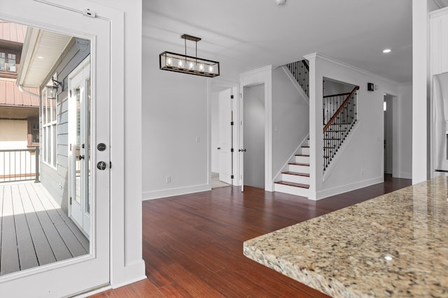 interior space with recessed lighting, stairway, dark wood-type flooring, ornamental molding, and baseboards