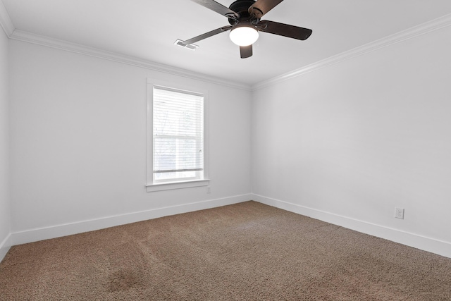 carpeted empty room featuring baseboards, visible vents, ceiling fan, and crown molding