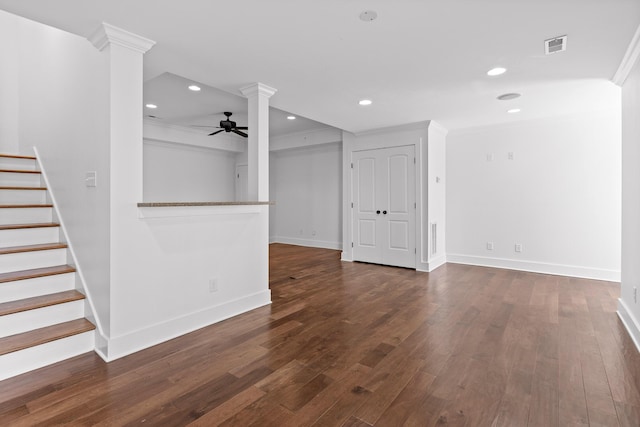 spare room featuring recessed lighting, dark wood-style flooring, a ceiling fan, ornamental molding, and decorative columns