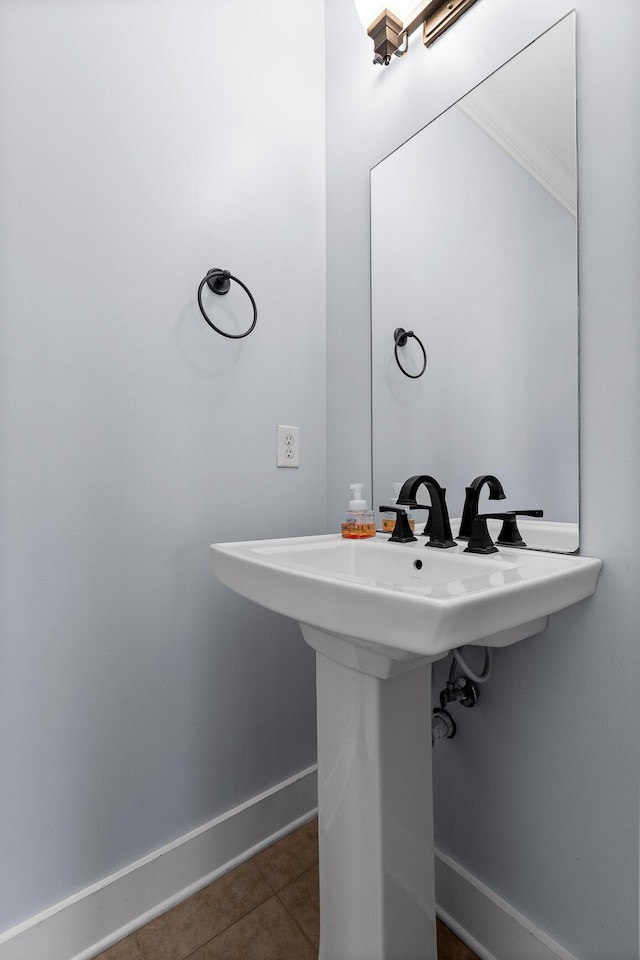 bathroom featuring tile patterned flooring and baseboards