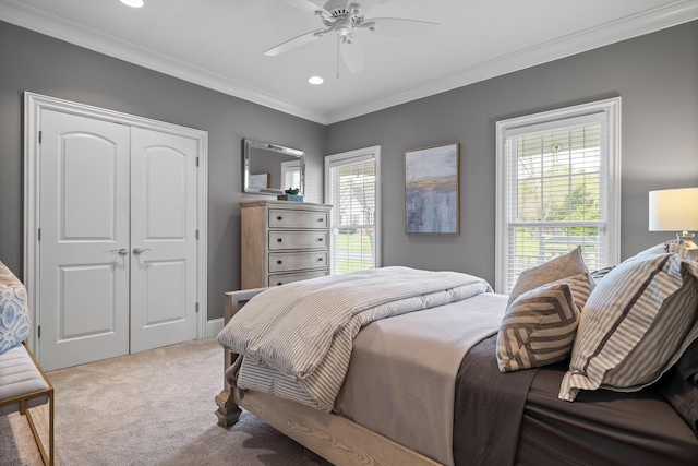 bedroom with recessed lighting, a closet, carpet flooring, and ornamental molding