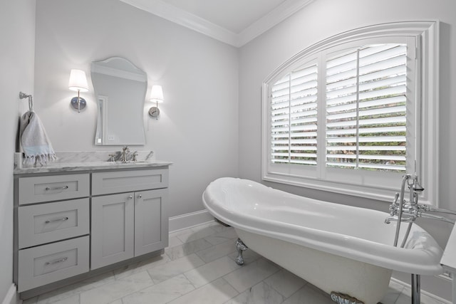 full bathroom featuring a freestanding bath, crown molding, marble finish floor, and vanity