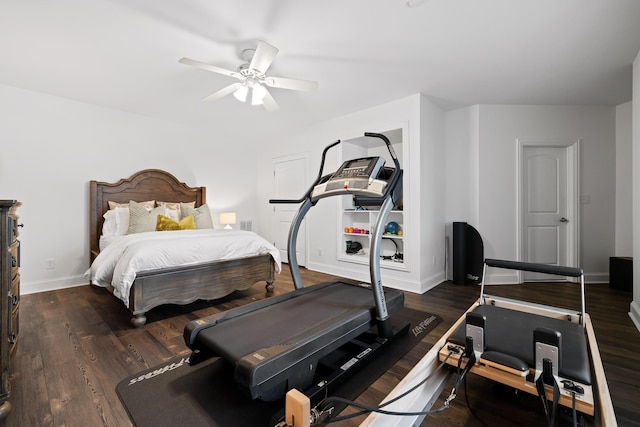 bedroom featuring baseboards, a ceiling fan, and wood finished floors