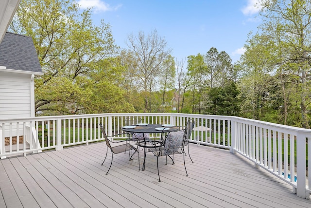 wooden deck featuring outdoor dining space