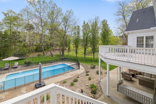 view of pool featuring a fenced in pool, fence, an outdoor hangout area, a patio, and a deck