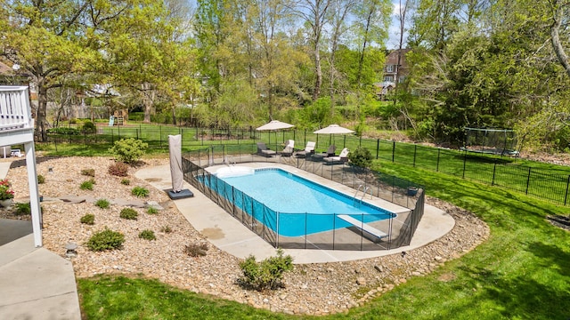 view of pool with a yard, a fenced in pool, and fence