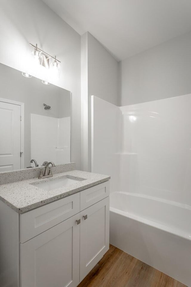 186 Andros Dr Unit 20D, Dalton, GA 30721 - bathroom featuring shower / bath combination, vanity, and wood-type flooring