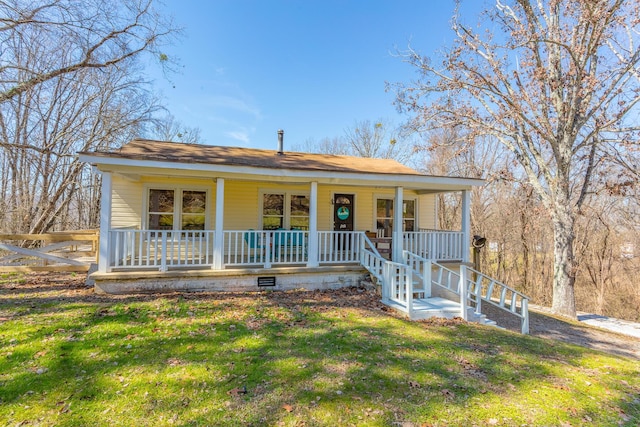 view of front of home with covered porch and a front yard