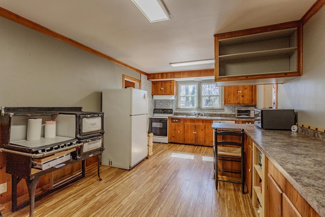 kitchen featuring white appliances, light wood finished floors, decorative backsplash, crown molding, and open shelves