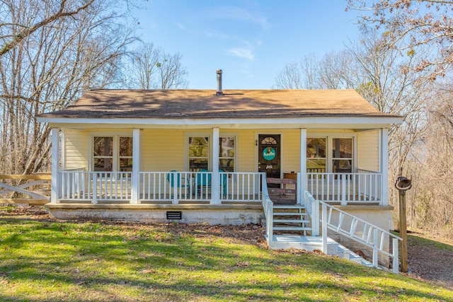 view of front of house featuring covered porch, a front lawn, crawl space, and stairs