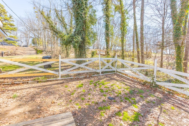 view of gate with fence