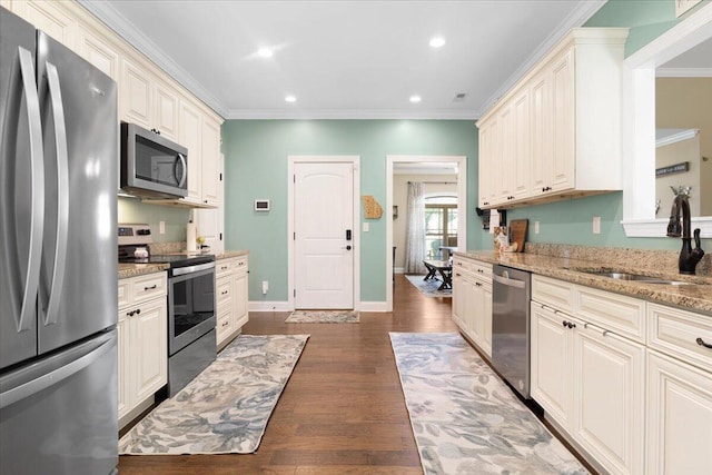 55 E Acorn Dr, Rock Spring, GA 30739 - kitchen featuring stainless steel appliances, a sink, light stone countertops, ornamental molding, and dark wood-type flooring