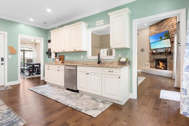 55 E Acorn Dr, Rock Spring, GA 30739 - kitchen with stainless steel dishwasher, a sink, dark wood finished floors, a fireplace, and white cabinetry