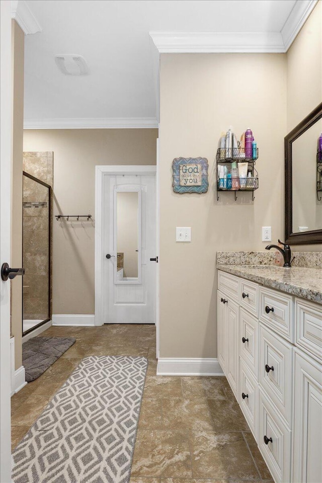 55 E Acorn Dr, Rock Spring, GA 30739 - bathroom with crown molding, a stall shower, vanity, baseboards, and stone finish flooring
