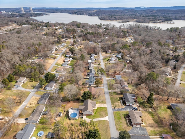 drone / aerial view with a water view and a residential view