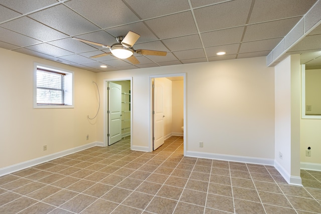 interior space featuring light tile patterned floors, a paneled ceiling, recessed lighting, ceiling fan, and baseboards