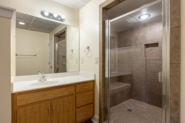 bathroom featuring a stall shower and vanity