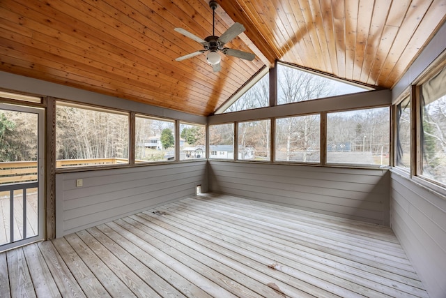 unfurnished sunroom with lofted ceiling, wooden ceiling, and ceiling fan