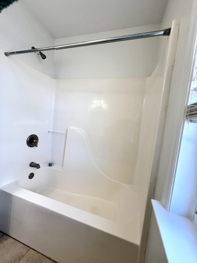 bathroom featuring shower / washtub combination and tile patterned floors