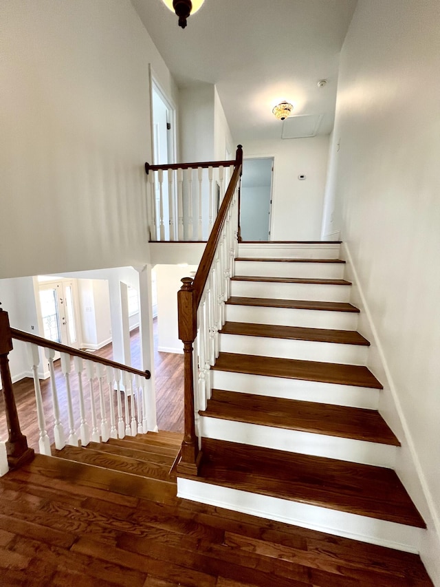 stairs with wood finished floors