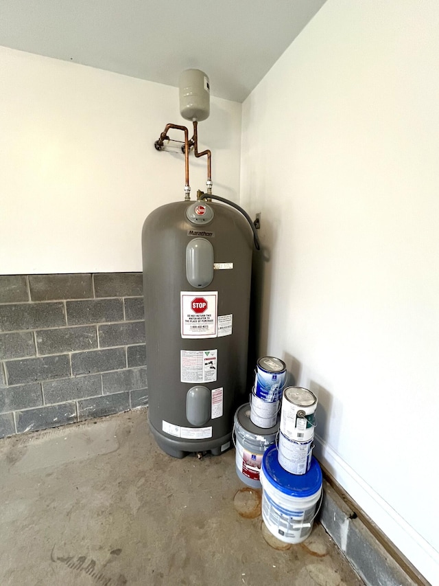 utility room featuring electric water heater