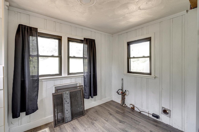 interior space featuring baseboards and light wood-type flooring