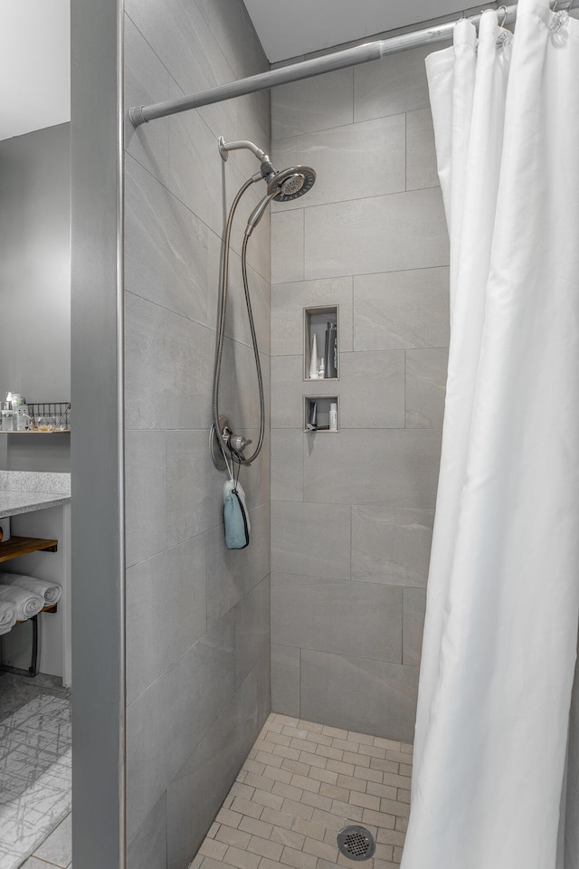 full bath featuring a shower stall