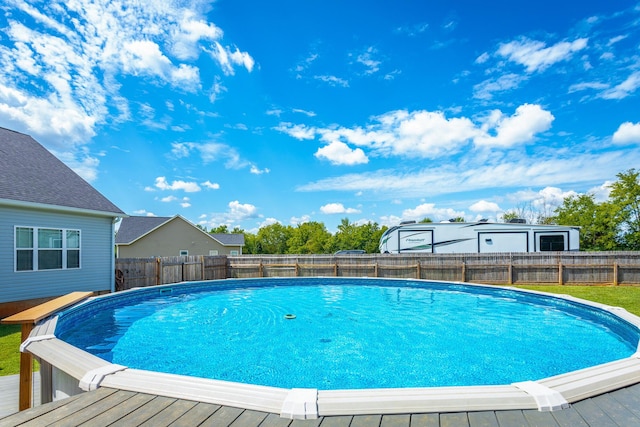 view of pool featuring a fenced backyard, a fenced in pool, and a wooden deck